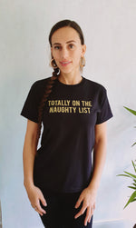 Cargar imagen en el visor de la galería, Totally On The Naughty List Gold Glitter Slogan Tee In Black
